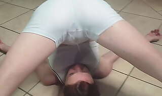 Skinny girl pissing on her own face and in her mouth through white pants