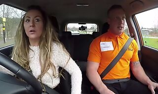Long-haired MILF blows her car driving school