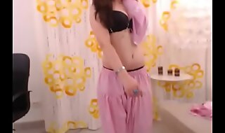 LittleTeenBB Extract briefly Riley wears pink saree, strips revealing black bra and panties and heels, exploitatory girl.
