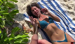 Pissed on girl on a public beach - She was shocked
