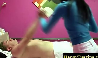 Asian masseur gives a sexy rub down