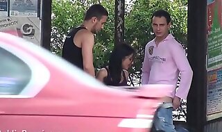 A big natural breasted brunette in public street bus stop threesome orgy gang bang with 2 hung guys with big dicks fucking her with a blowjob and vaginal pussy sex action in front of all the car bus and truck drivers and people walking on the street